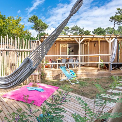BUNGALOW 4 personnes - Garden 2ch-CLIM-baignoire-TV-LV-plancha-terrasse couverte-31m² | PREMIUM