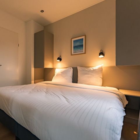 Lodge 2 personnes - Pavillon d'eau avec bain à remous